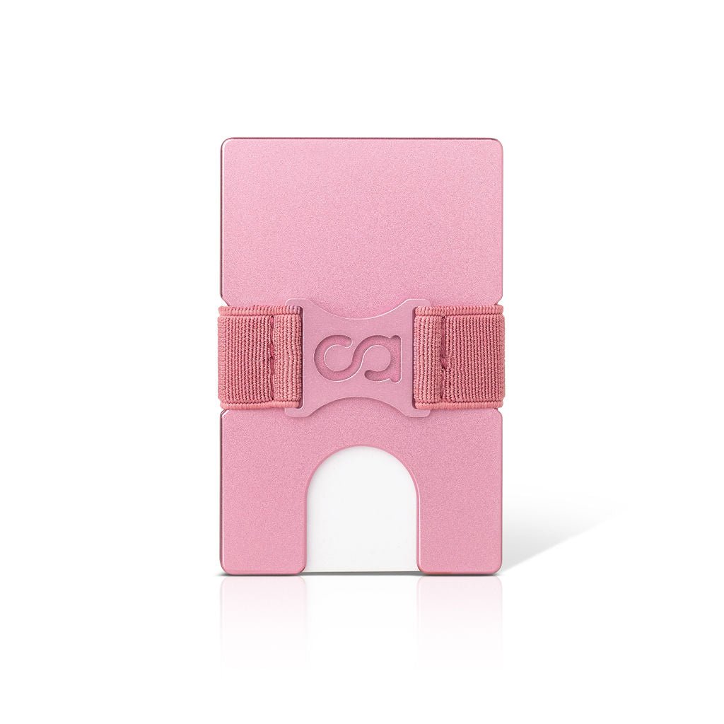 a pink pink suitcase is sitting on a table 